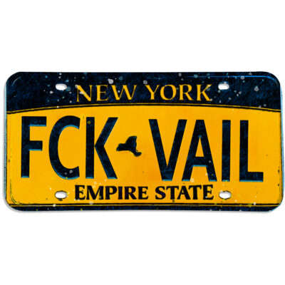 Graphic sticker of New York state license plate reading "FCK Vail"